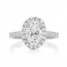 Oval Cut Engagement Ring With Seamless Claw Set Halo